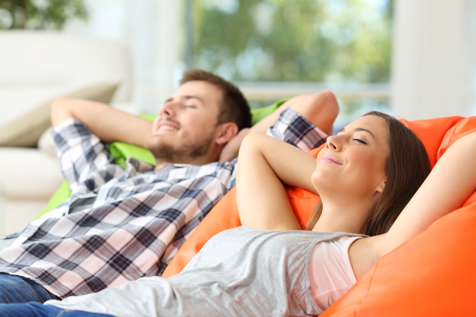 Couple or roommates relaxing at home Couple or roommates relaxing at home