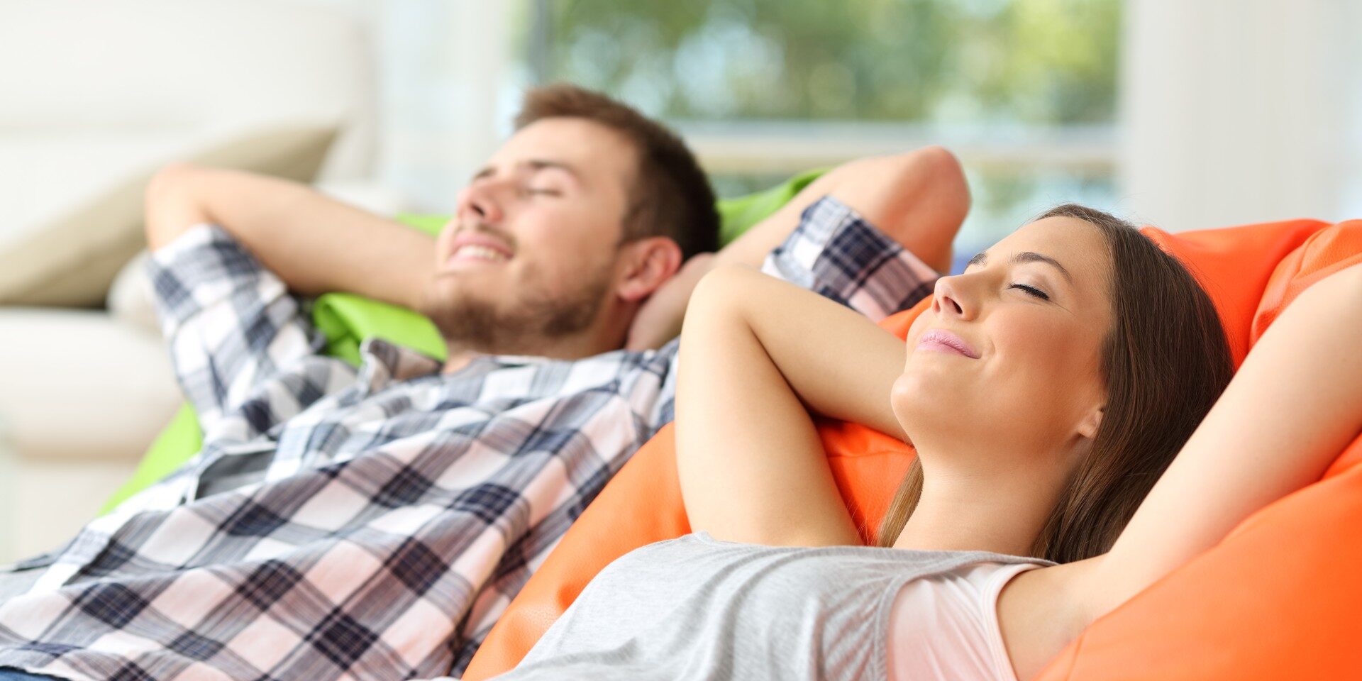 Couple or roommates relaxing at home